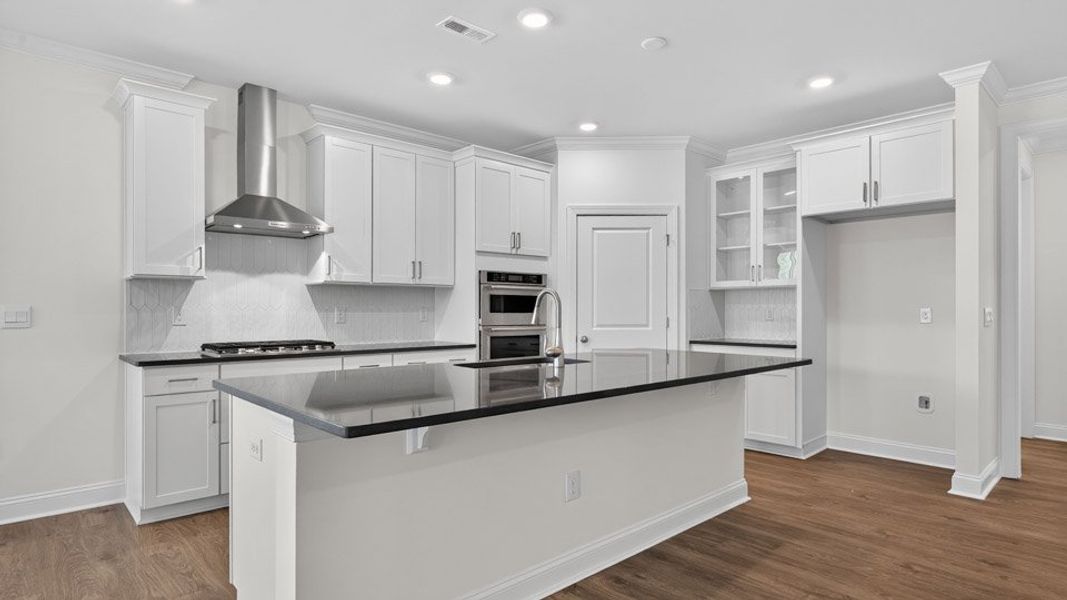 Furnished interior view inside a new home in The Estates Park, Apex (Image 5).