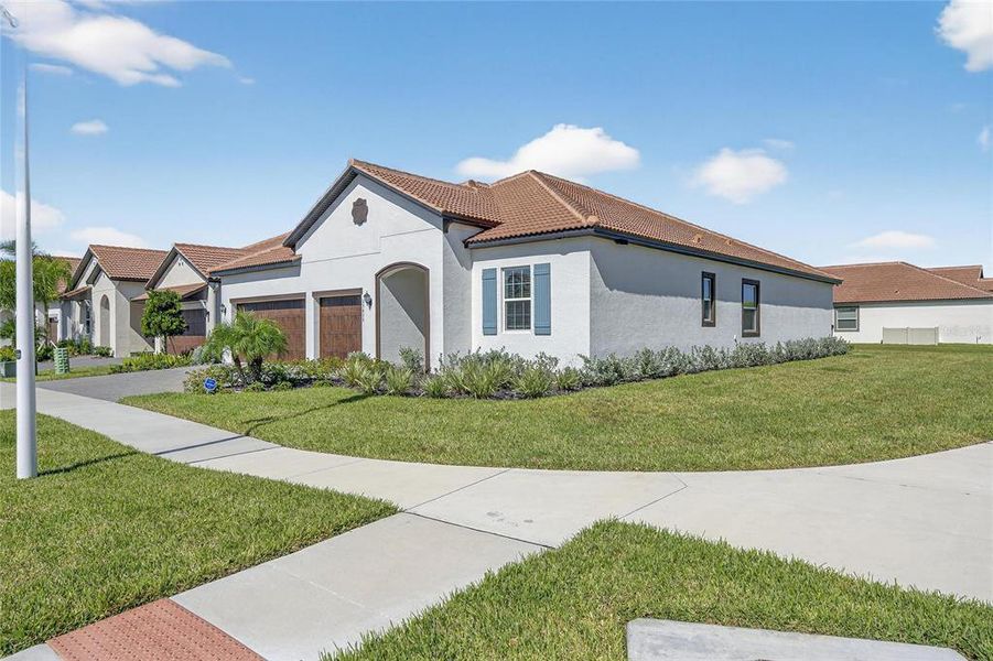 Front exterior of a new home in , Wimauma, FL, highlighting curb appeal (Image 30).