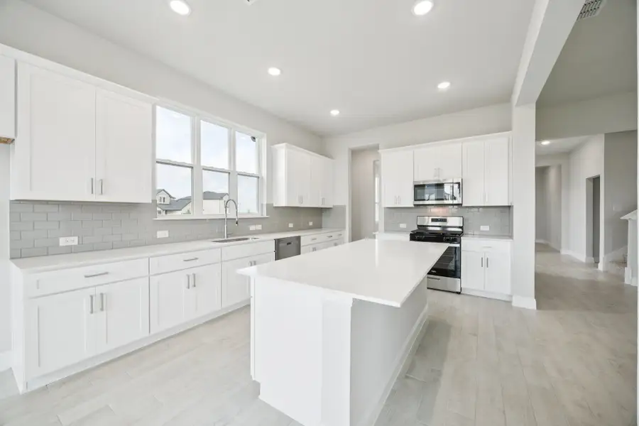 Representative furnished interior of a home built from the Regency II by Megatel Homes in Bellagio, Forney (Image 4).