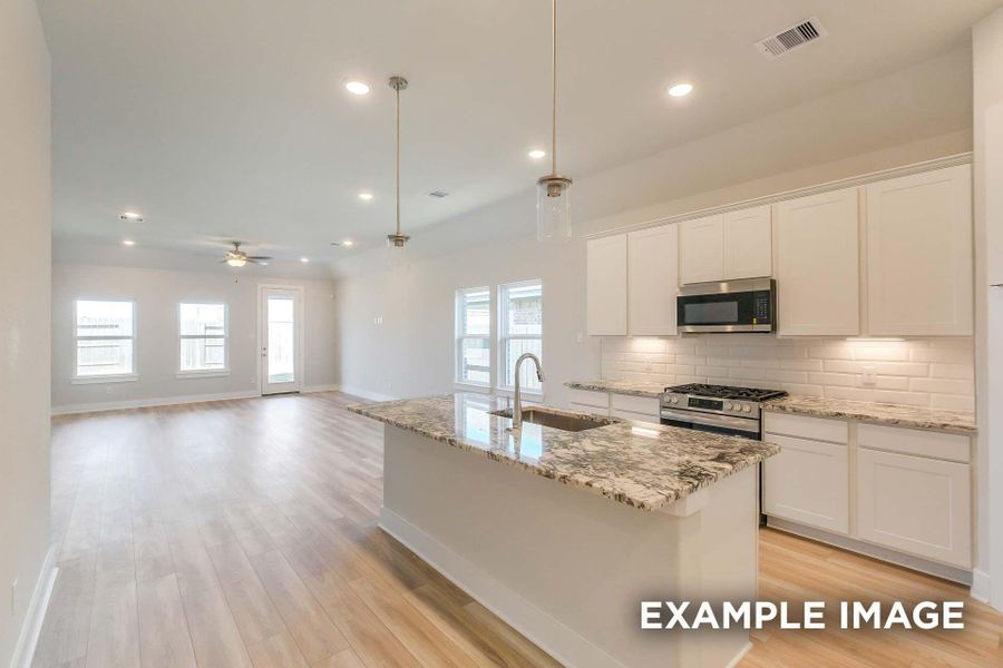 Furnished interior view inside a new home in Sunterra, Katy (Image 3).