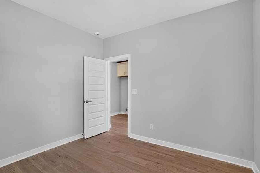 Spacious, unfurnished interior of a new home in The Cottages at East Lanier, Fayetteville (Image 13).