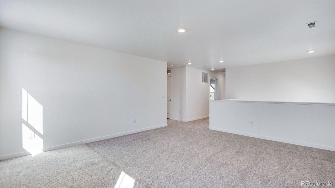 Spacious, unfurnished interior of a new home in Sky Ranch, Watkins (Image 22).