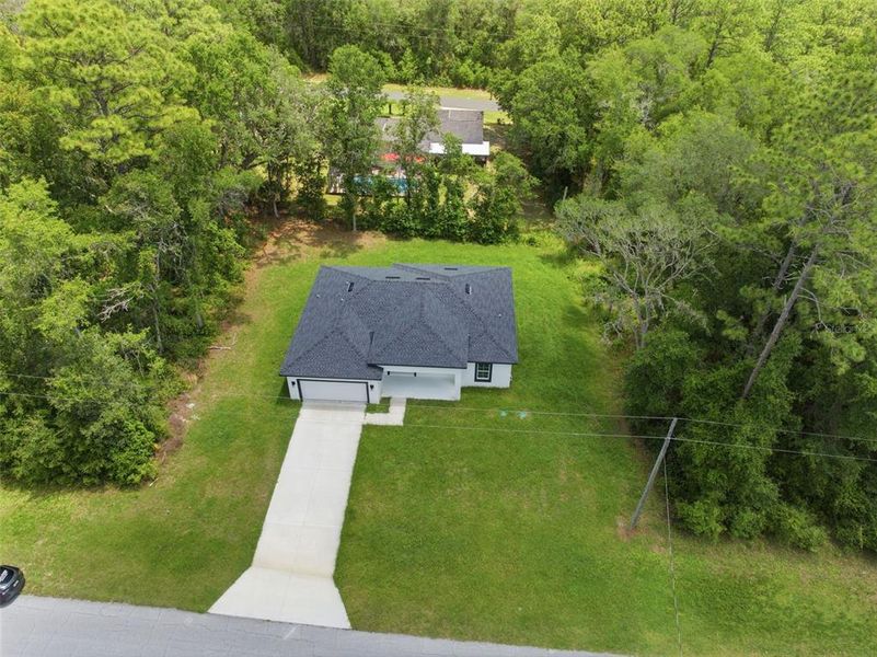 Front exterior of a new home in , Citrus Springs, FL, highlighting curb appeal (Image 17).
