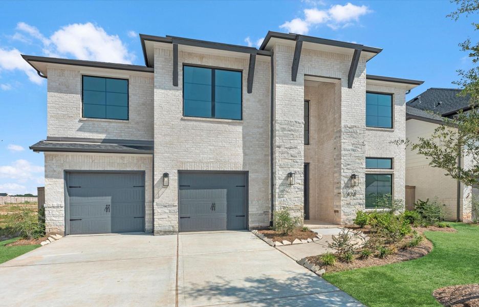 Front exterior of a new home in Grange - 55', Katy, TX, highlighting curb appeal (Image 1). Front exterior of a new home in Grange - 55', Katy, TX, highlighting curb appeal (Image 1).