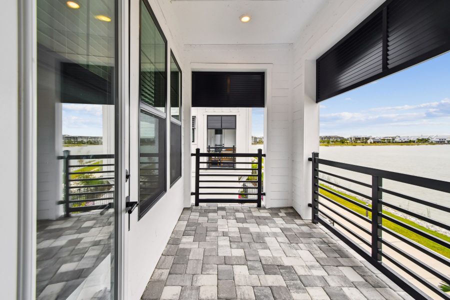 Exterior details and patio area of a home in Emerald Landing at Waterside at Lakewood Ranch – City Homes, Sarasota (Image 3).