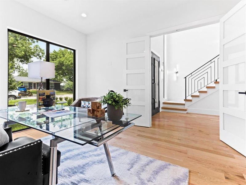 Office area with light hardwood / wood-style flooring