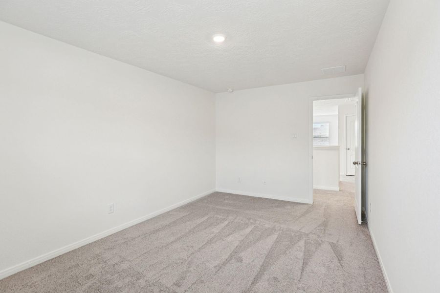 Secondary bedroom looking out to hallway.