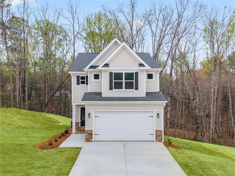 Front exterior of a new home in , Braselton, GA, highlighting curb appeal (Image 18).