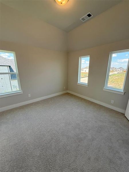 Spare room featuring baseboards and light colored carpet Spare room featuring baseboards and light colored carpet