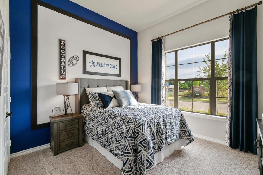 Bedroom 2 | Concept 2434 at Coyote Crossing in Godley, TX by Landsea Homes