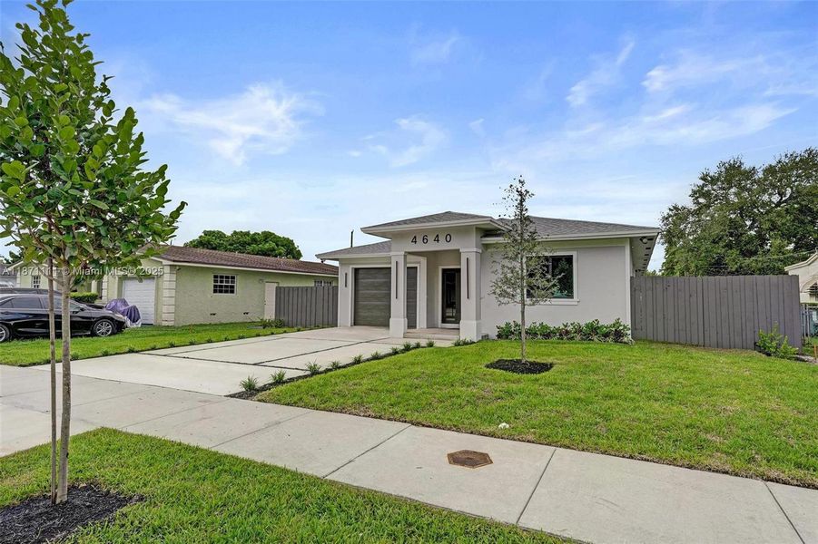 Front exterior of a new home in , West Park, FL, highlighting curb appeal (Image 32). Front exterior of a new home in , West Park, FL, highlighting curb appeal (Image 32).