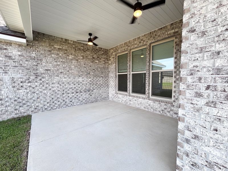 Exterior details and patio area of a home in Bird Song at Hammock Bay, Freeport (Image 3).