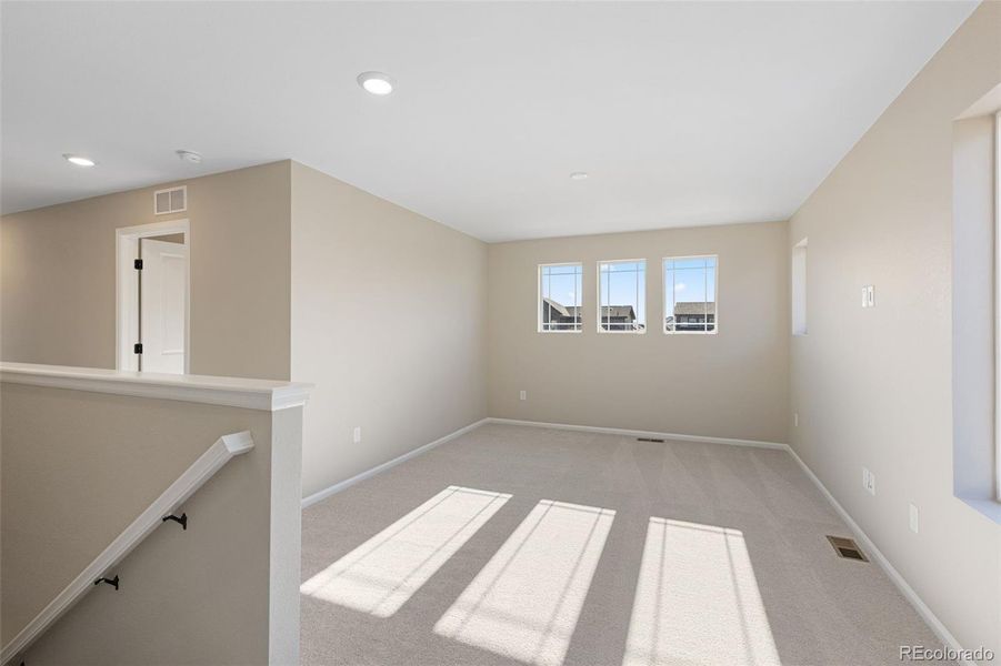 Spacious, unfurnished interior of a new home in The Cottages Collection at Ridgeline Vista, Brighton (Image 15).