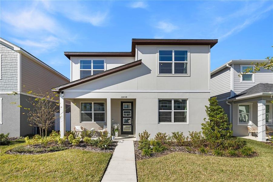 Front exterior of a new home in , Orlando, FL, highlighting curb appeal (Image 24).