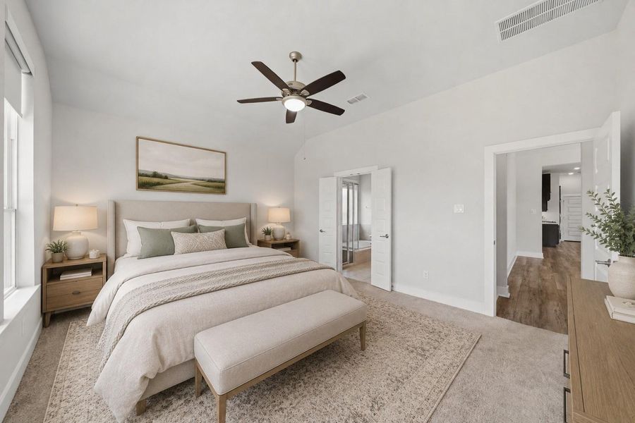 Generous primary bedroom with plush carpeting and abundant natural light. *Photo is virtually staged* Generous primary bedroom with plush carpeting and abundant natural light. *Photo is virtually staged*