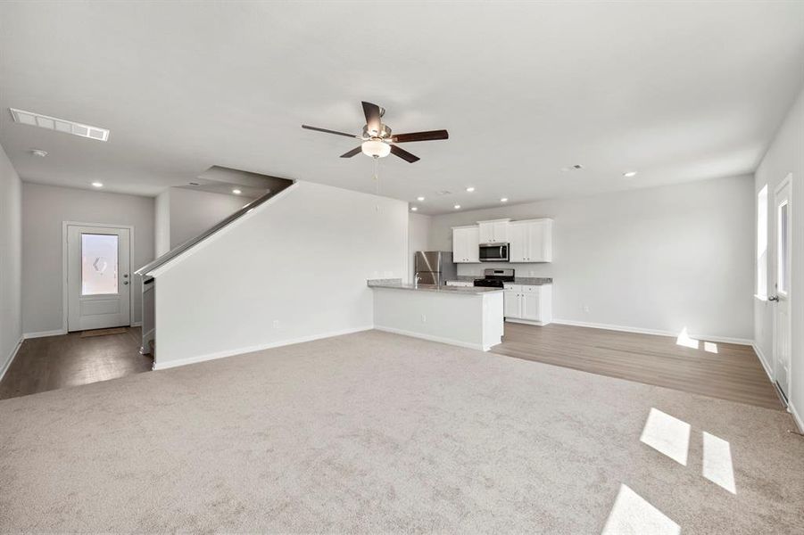 Spacious living room, open to the kitchen and dining area.