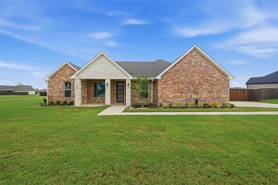 Front exterior of a new home in , Pottsboro, TX, highlighting curb appeal (Image 2). Front exterior of a new home in , Pottsboro, TX, highlighting curb appeal (Image 2).