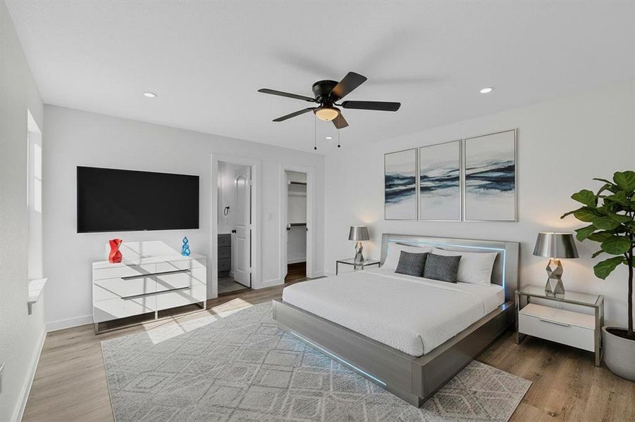 Bedroom featuring a walk in closet, light wood-type flooring, ceiling fan, and recessed lighting