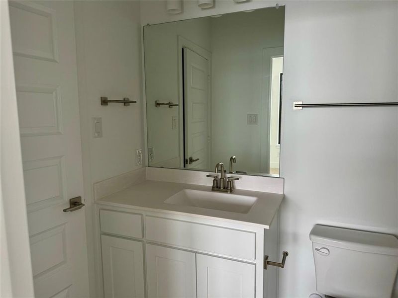 Bathroom featuring vanity and toilet