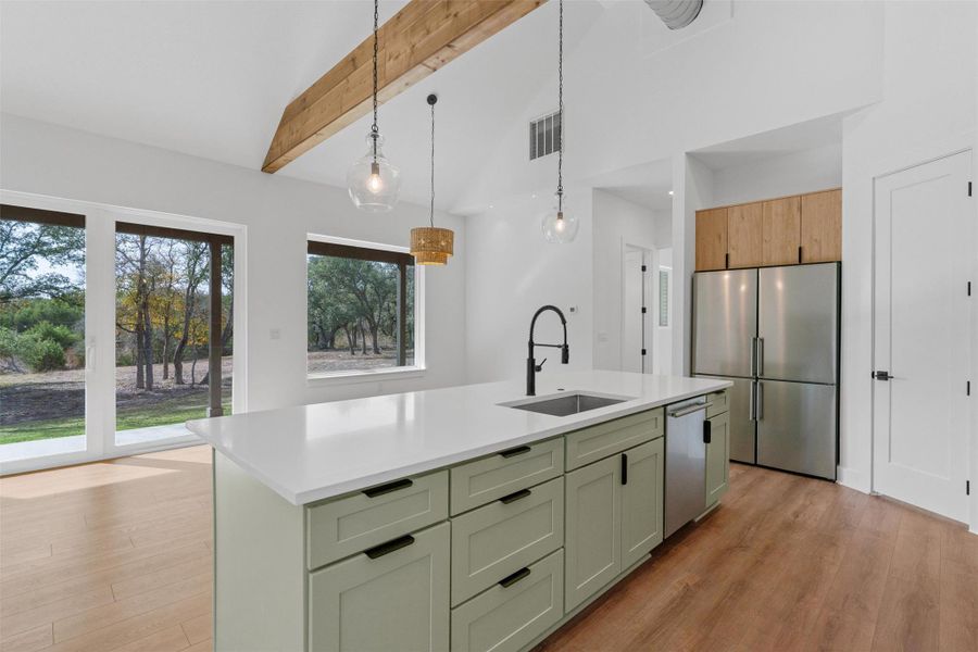 A sleek, functional kitchen layout with ample counter space, modern finishes, and a design that makes cooking and hosting feel effortless. A sleek, functional kitchen layout with ample counter space, modern finishes, and a design that makes cooking and hosting feel effortless.