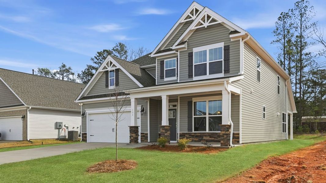 Front exterior of a new home in Seven Oaks, Greenwood, SC, highlighting curb appeal (Image 2). Front exterior of a new home in Seven Oaks, Greenwood, SC, highlighting curb appeal (Image 2).
