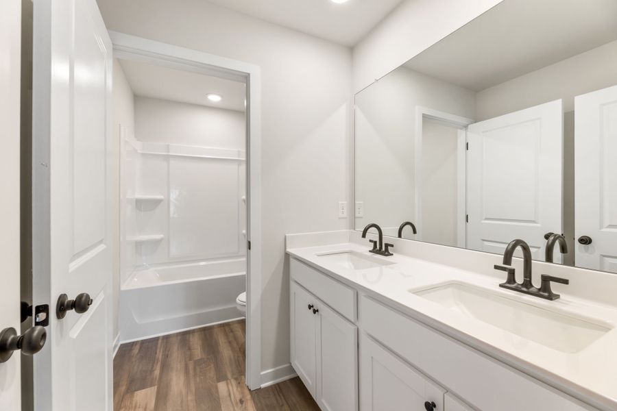 A bathroom with a glass shower. A bathroom with a glass shower.
