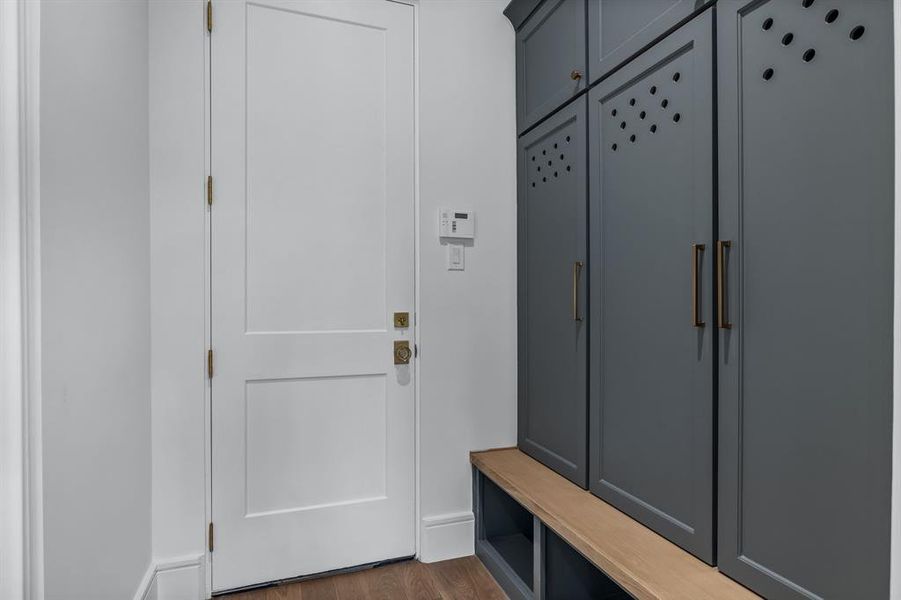 Mudroom with dark wood-type flooring