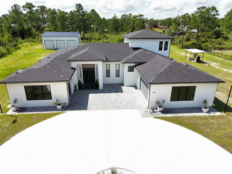 Front exterior of a new home in , Orlando, FL, highlighting curb appeal (Image 31). Front exterior of a new home in , Orlando, FL, highlighting curb appeal (Image 31).