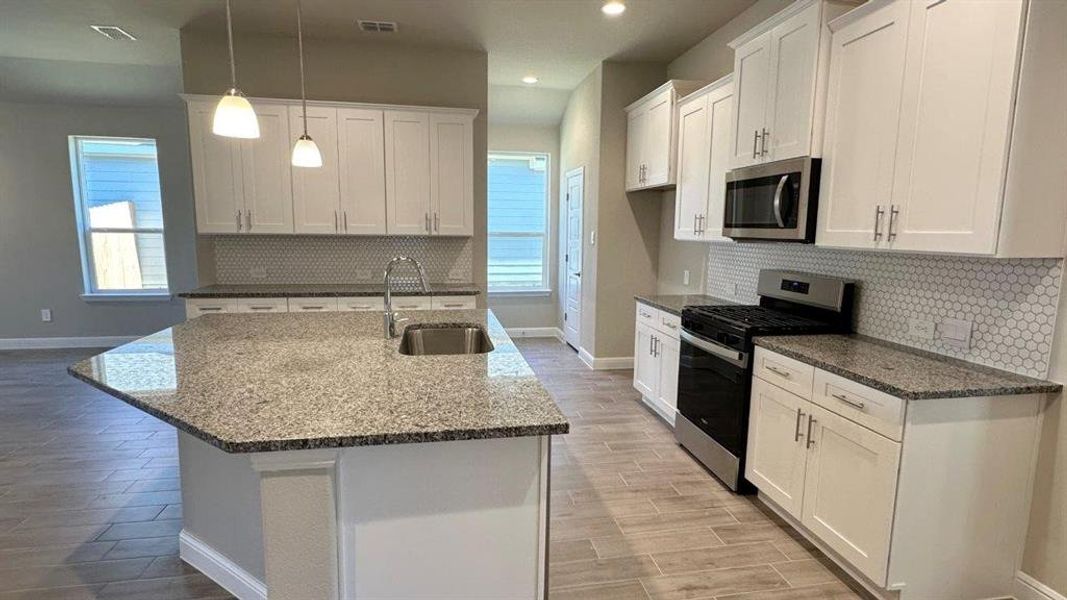 Kitchen - All Home and community information, including pricing, included features, terms, availability and amenities, are subject to change at any time without notice or obligation. All Drawings, pictures, photographs, video, square footages, floor plans, elevations, features, colors and sizes are approximate for illustration purposes only and will vary from the homes as built. Kitchen - All Home and community information, including pricing, included features, terms, availability and amenities, are subject to change at any time without notice or obligation. All Drawings, pictures, photographs, video, square footages, floor plans, elevations, features, colors and sizes are approximate for illustration purposes only and will vary from the homes as built.