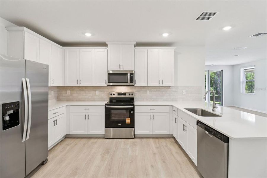 Furnished interior view inside a new home in Ridgehaven - Villas, Ormond Beach (Image 11).