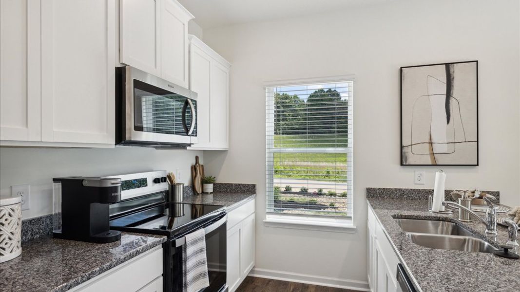 Representative furnished interior of a home built from the Altamont Townhome by D.R. Horton in Saint Marc's, Powell (Image 5).