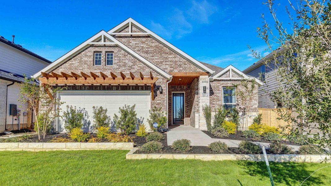 Representative exterior photo of a completed home built from the Palm by DRB Homes in Briarwood, Elgin, TX (Image 23).