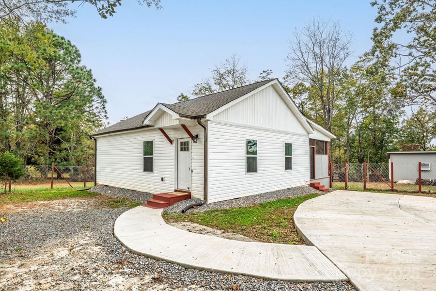Front exterior of a new home in , Spindale, NC, highlighting curb appeal (Image 1).