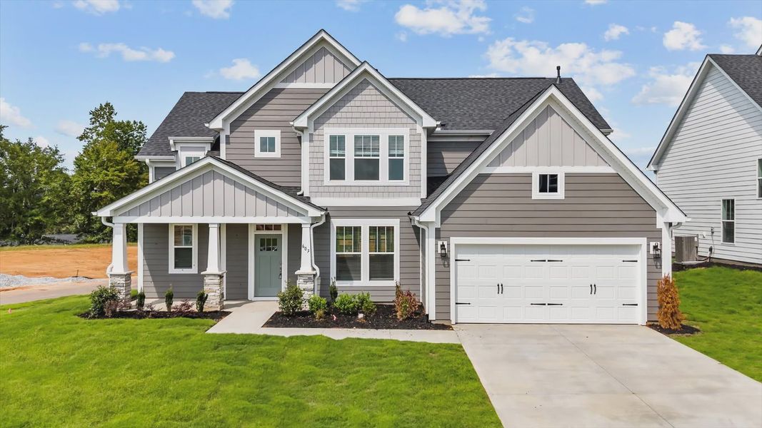 Front exterior of a new home in Wells Crossing, Seneca, SC, highlighting curb appeal (Image 1). Front exterior of a new home in Wells Crossing, Seneca, SC, highlighting curb appeal (Image 1).