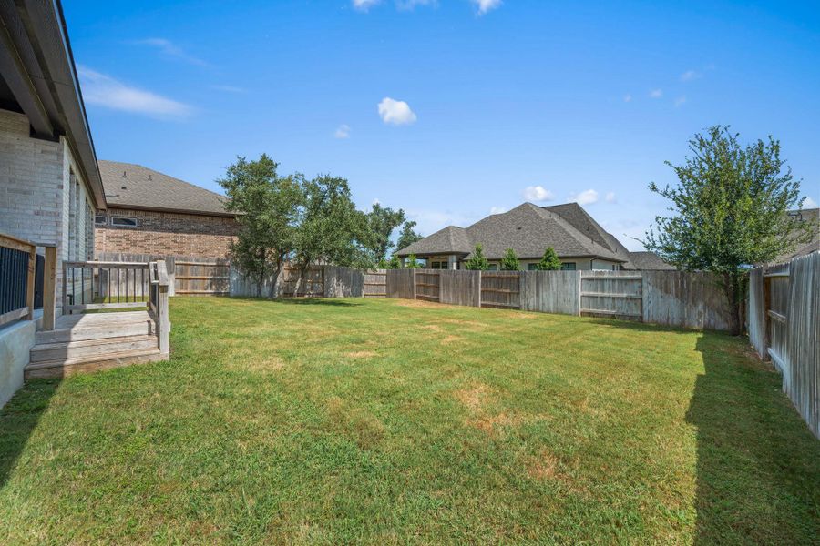 A generously proportioned, fully fenced backyard, ideal for outdoor leisure. A generously proportioned, fully fenced backyard, ideal for outdoor leisure.