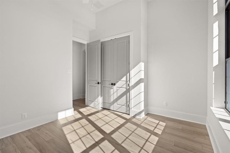 Luxury Vinyl Plank flooring in secondary bedroom