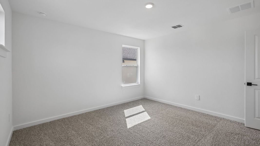 Spacious, unfurnished interior of a new home in Rosenbusch Ranch, Leander (Image 53).