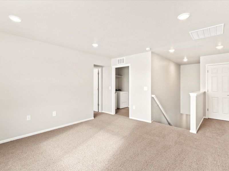 Spacious, unfurnished interior of a new home in Frontier Estates - The Flora Collection, Firestone (Image 11). Spacious, unfurnished interior of a new home in Frontier Estates - The Flora Collection, Firestone (Image 11).