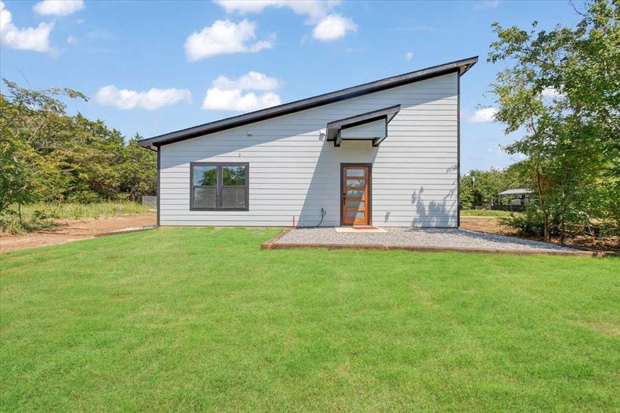 Front exterior of a new home in , Gordonville, TX, highlighting curb appeal (Image 18). Front exterior of a new home in , Gordonville, TX, highlighting curb appeal (Image 18).