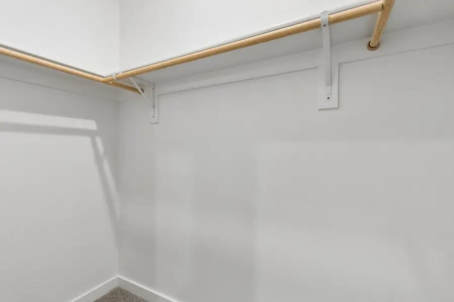 Primary Closet in the Cypress home plan by Trophy Signature Homes - REPRESENTATIVE PHOTO