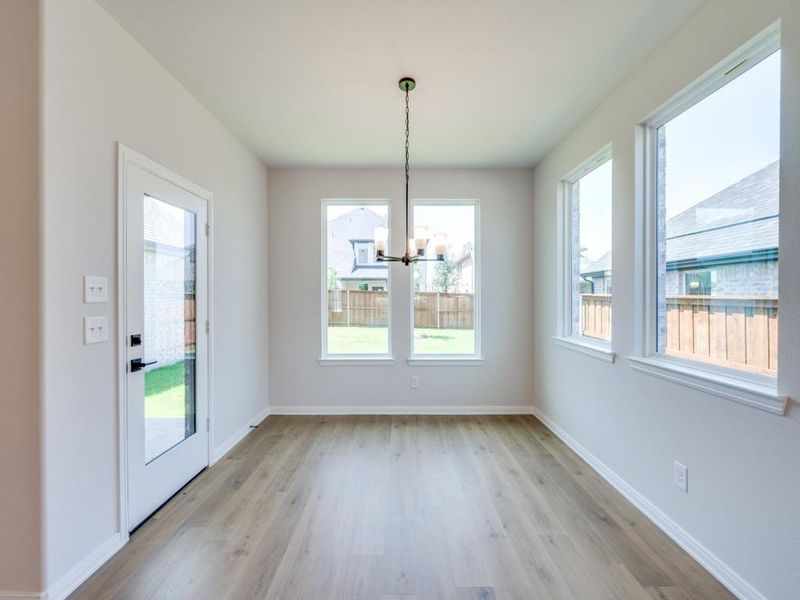 With windows everywhere you look, this lovely dining room brings the outside in!