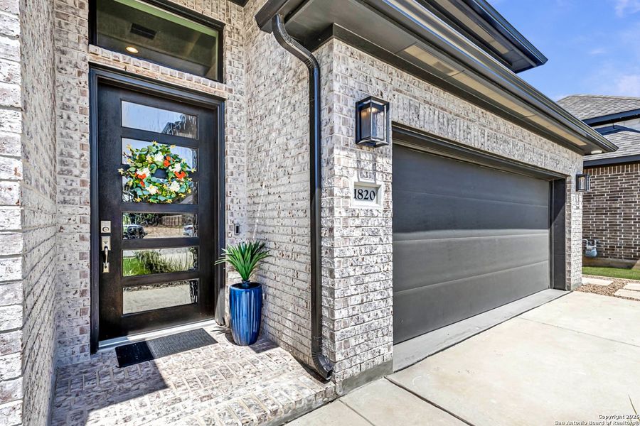 Front exterior of a new home in , Bulverde, TX, highlighting curb appeal (Image 19). Front exterior of a new home in , Bulverde, TX, highlighting curb appeal (Image 19).