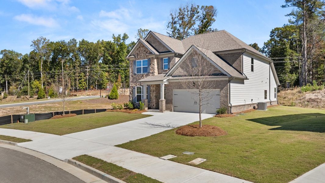 Representative exterior photo of a completed home built from the WINDSOR by D.R. Horton in Butner Estates, South Fulton, GA (Image 33).