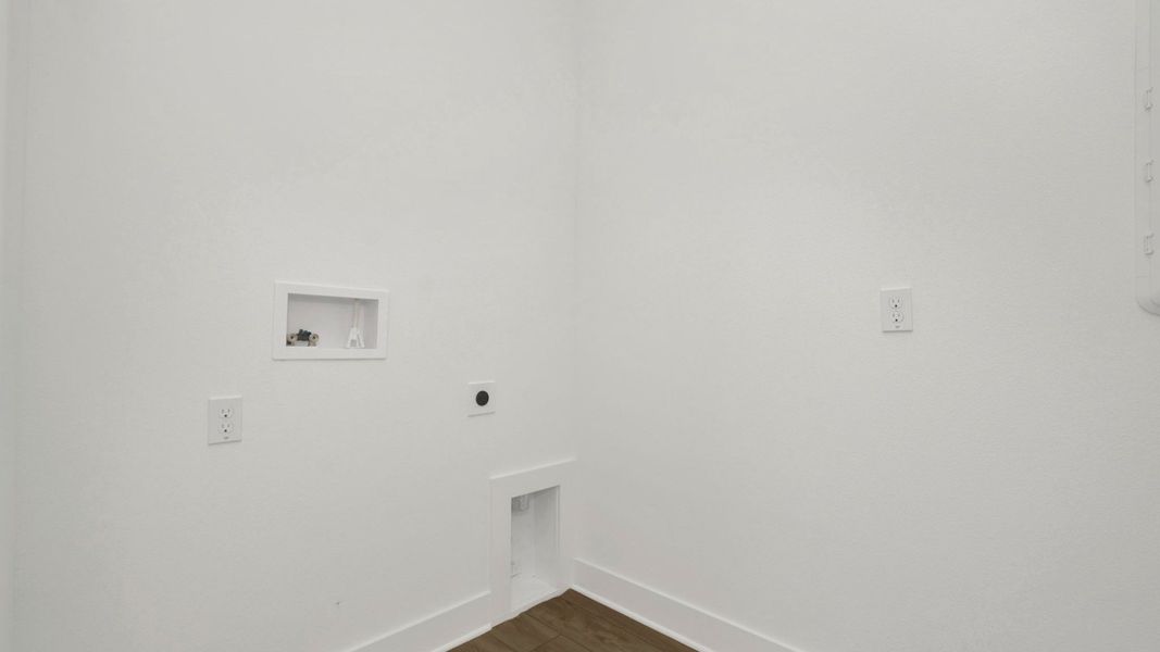 The Laundry Room  of a DRB Homes Grand Hawk which is offered as a home plan at Serengeti in Spring Hill, FL.