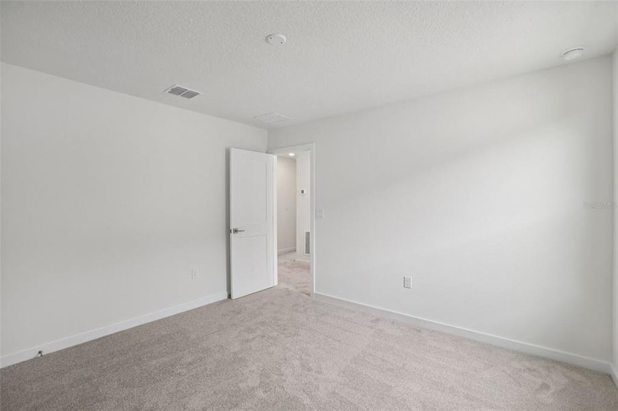 Spacious, unfurnished interior of a new home in Grasslands West, Lakeland (Image 41).