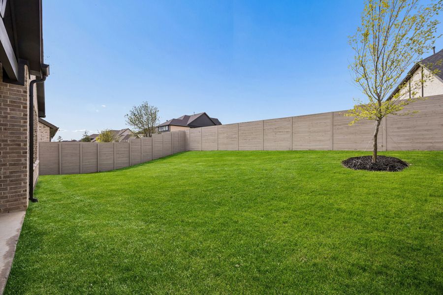 Exterior details and patio area of a home in Painted Tree Woodland West, McKinney (Image 19).