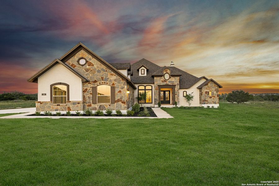 Front exterior of a new home in Potranco Acres, Castroville, TX, highlighting curb appeal (Image 25).