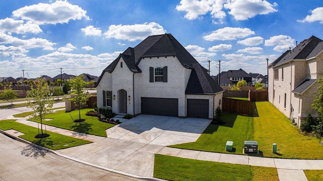 Front exterior of a new home in Estates at Rockhill, Frisco, TX, highlighting curb appeal (Image 2). Front exterior of a new home in Estates at Rockhill, Frisco, TX, highlighting curb appeal (Image 2).
