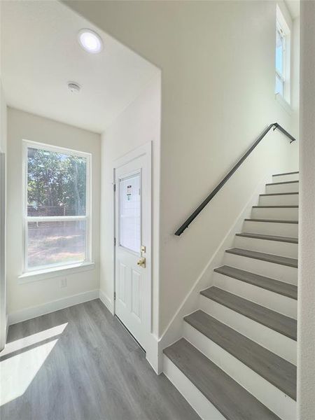 Foyer entrance with light hardwood / wood-style floors