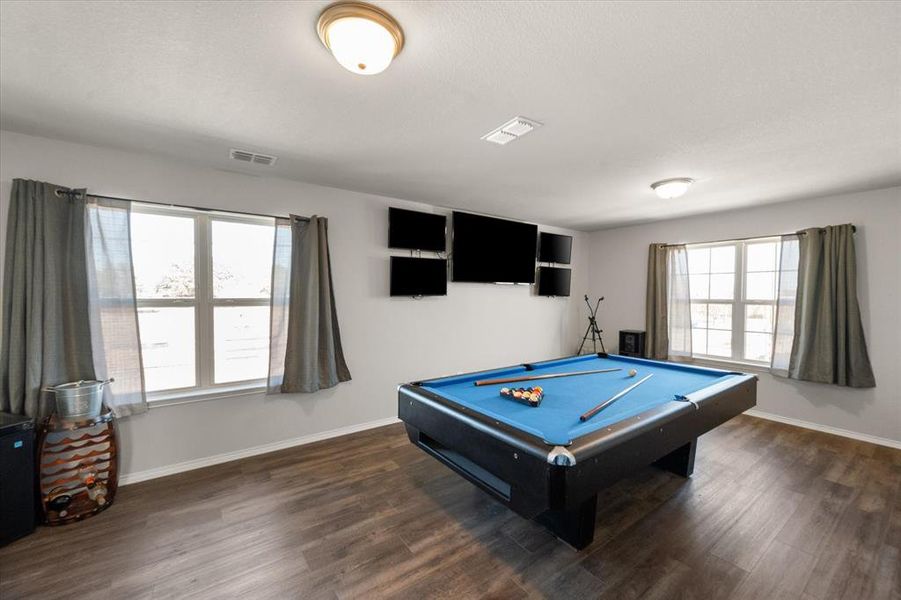 Rec room with dark hardwood / wood-style floors and pool table